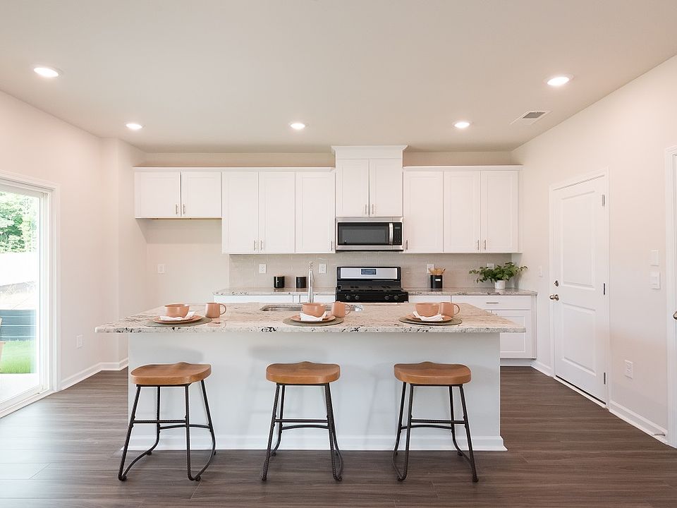 The spacious kitchen island overlooks the great room and covered patio.