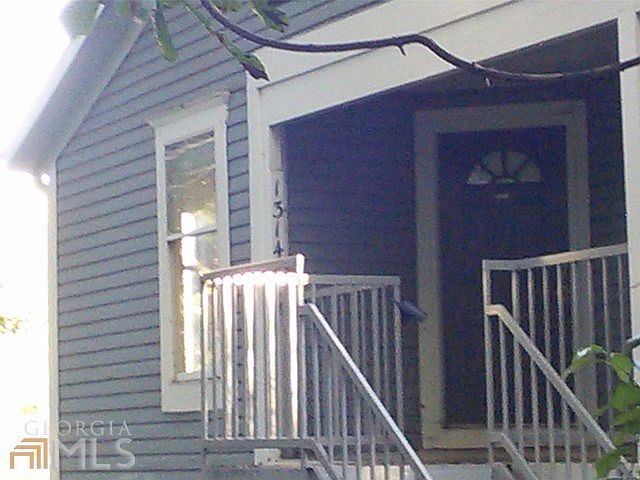 Top floor end unit with views of thick woods from your covered entry.