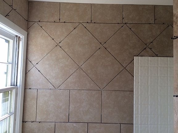Tile work in progress in 3/4 bath!