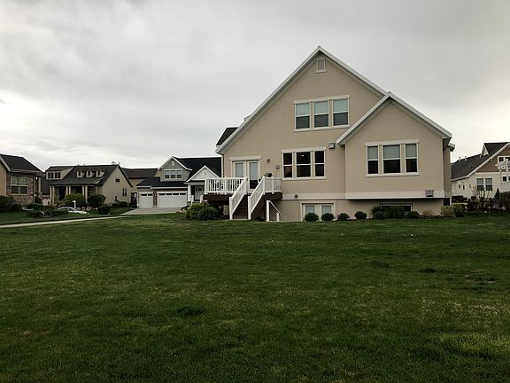 back of home with porch view