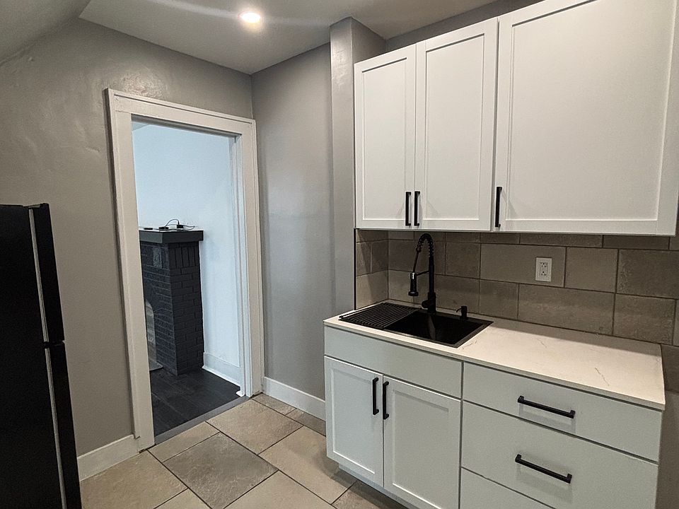newly updated kitchen with stove and fridge