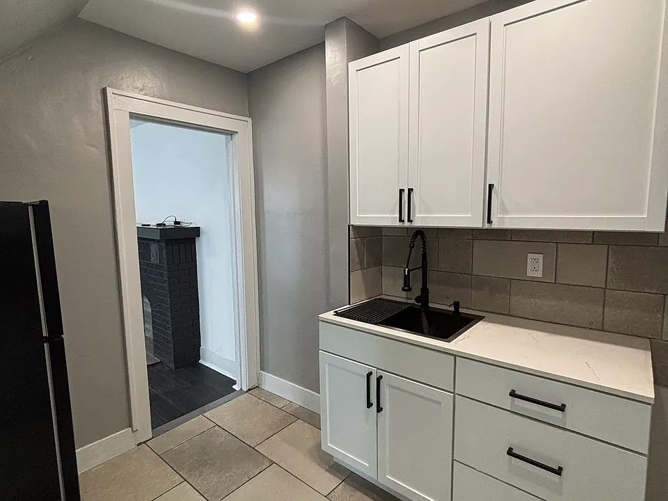 newly updated kitchen with stove and fridge