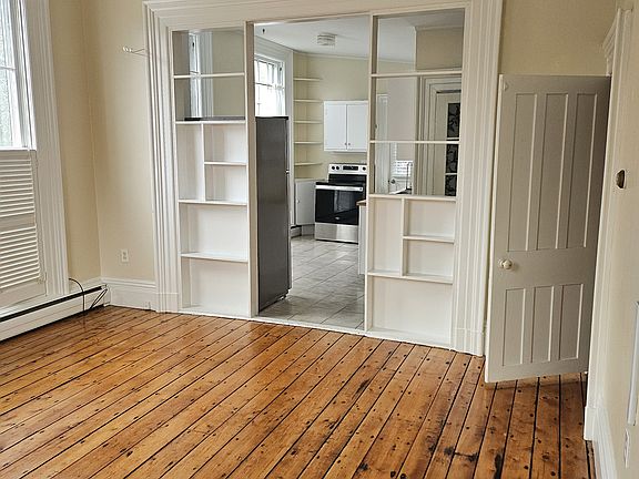 Grand living space with high ceilings and beautiful, large windows