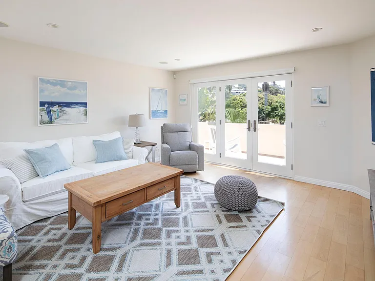 Spacious living room with bright natural light and a front patio to be enjoyed at any hour