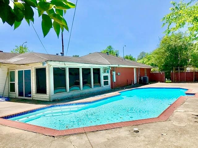 This pool has plenty of room for family and friends! And there is still room in the back for the BBQ pit and family to play around.