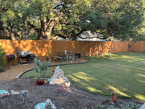 Back yard left. BBQ grills included