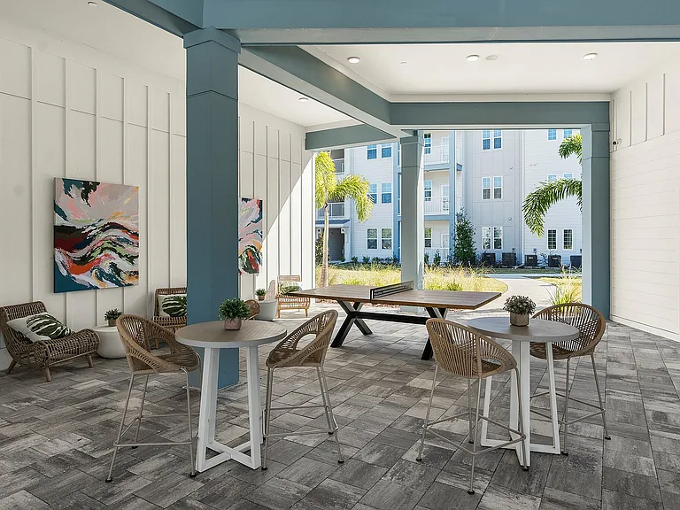 Relax in style with this chic outdoor lounge, a perfect blend of modern design and natural beauty.