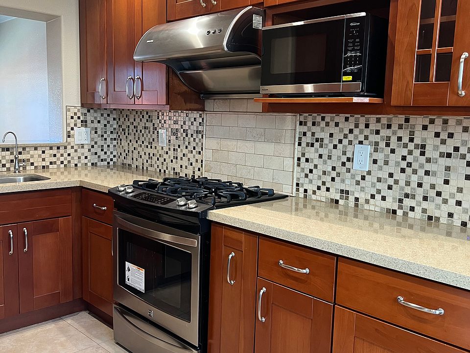 Remodeled Kitchen - gas stove, microwave, chimney and spice rack