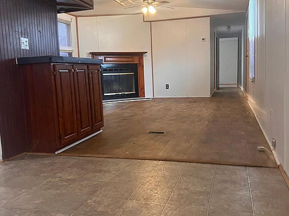 Spacious Living Room with Built in cabinets and Fireplace