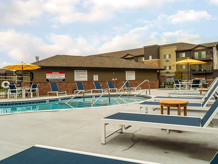 Enjoy sunny days poolside with plenty of lounge chairs and space to unwind.
