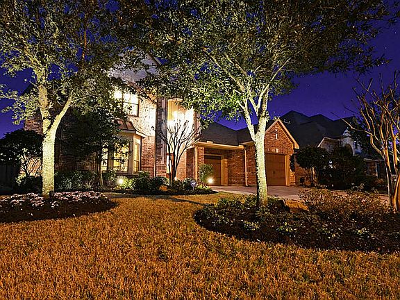 Home features professional landscape lighting!  Garage has specialty epoxy painted floor and custom painted walls!