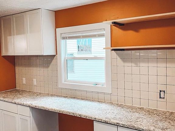 Plenty of counter space, trendy tile, and new cabinets