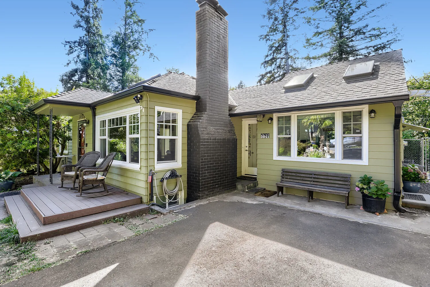 Front of home to left and large driveway for 2 parking spaces