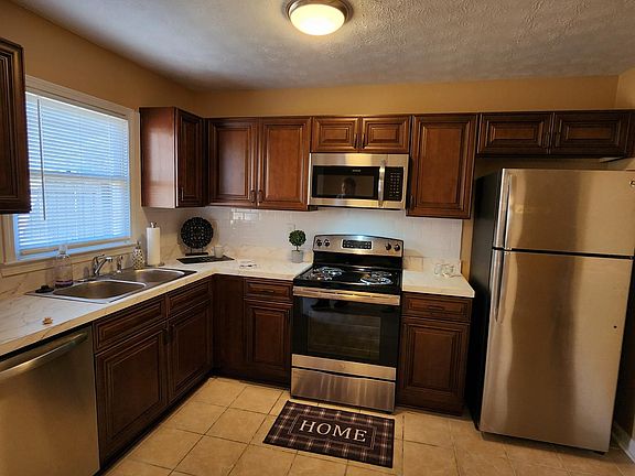 New cabinets, countertop, and SS appliances.