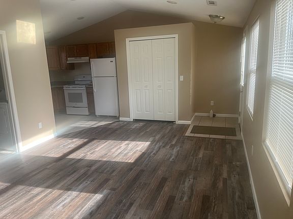 Open space - entrance to living room, dining area, and kitchen.