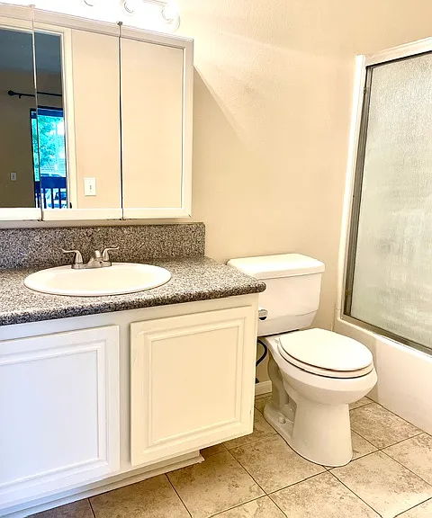Primary full bathroom with shower and bathtub