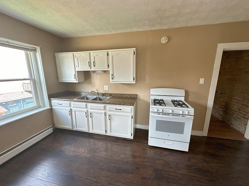 Cabinets, sink, and stove