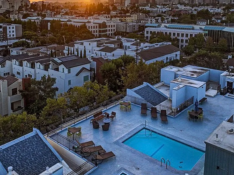 Rooftop heated pool/spa with 360 degree views of the city, lounge chairs and tanning beds.