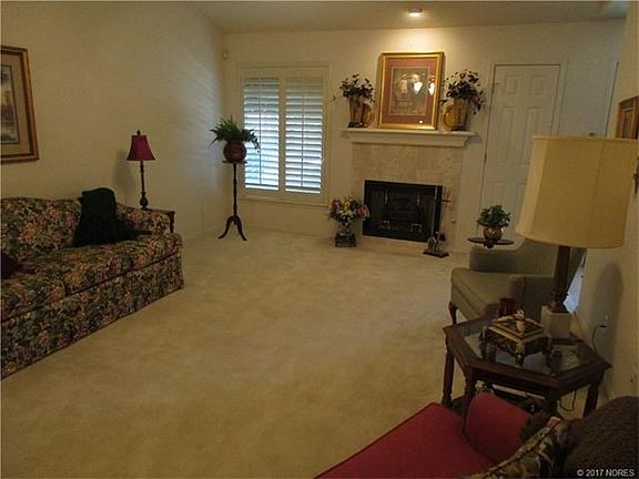 Large Living room with Plantation shutters and Gas Log Fire Place