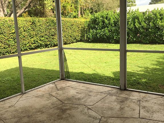 Large, screened Florida room with fan & light, overlooking private, landscaped, fenced backyard. (landlord maintains lawn and landscaping.)