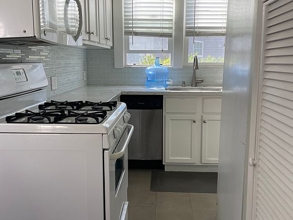 This kitchen may be skinny... but it packed with modern conveniences... including a large pantry