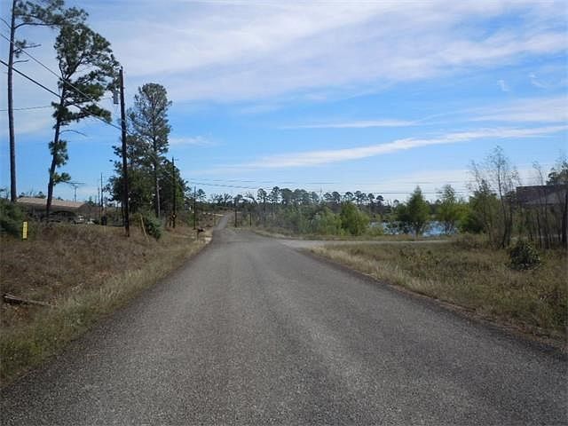 View looking East don Pine Shadows Lane from in front of Home Site