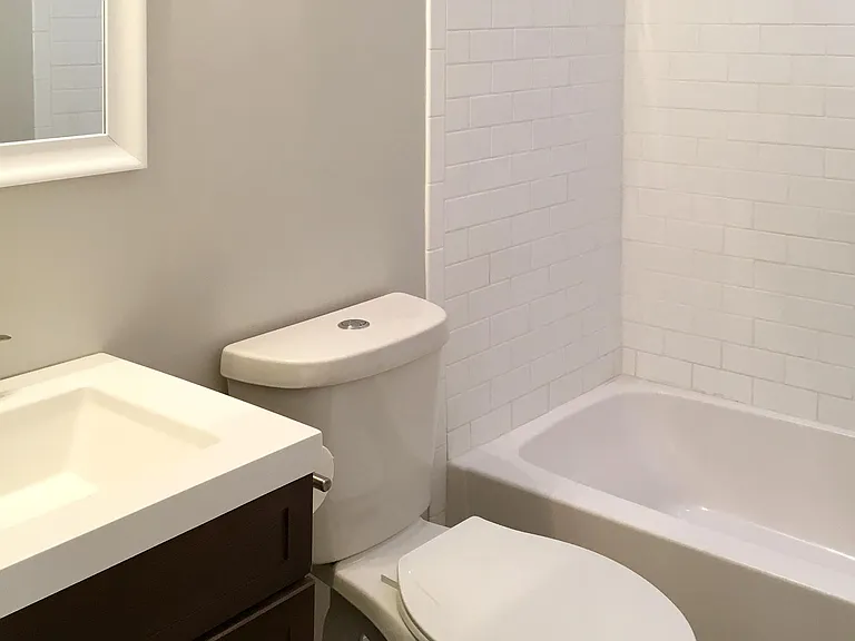 bathroom includes natural light from a suntube skylight