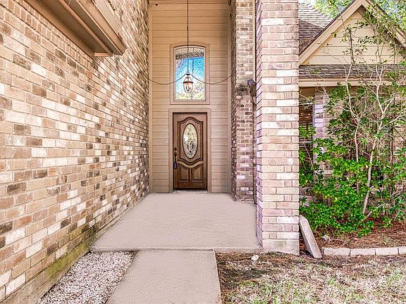 Approaching the front door you will see the beautiful brick elevation and covered front porch!