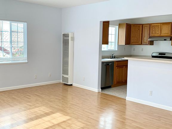 Unit #1 living room opens up into the kitchen
