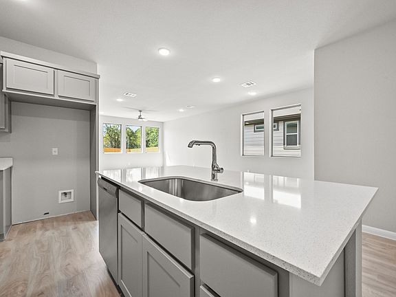 Kitchen in the Willow home plan by Trophy Signature Homes - REPRESENTATIVE PHOTO