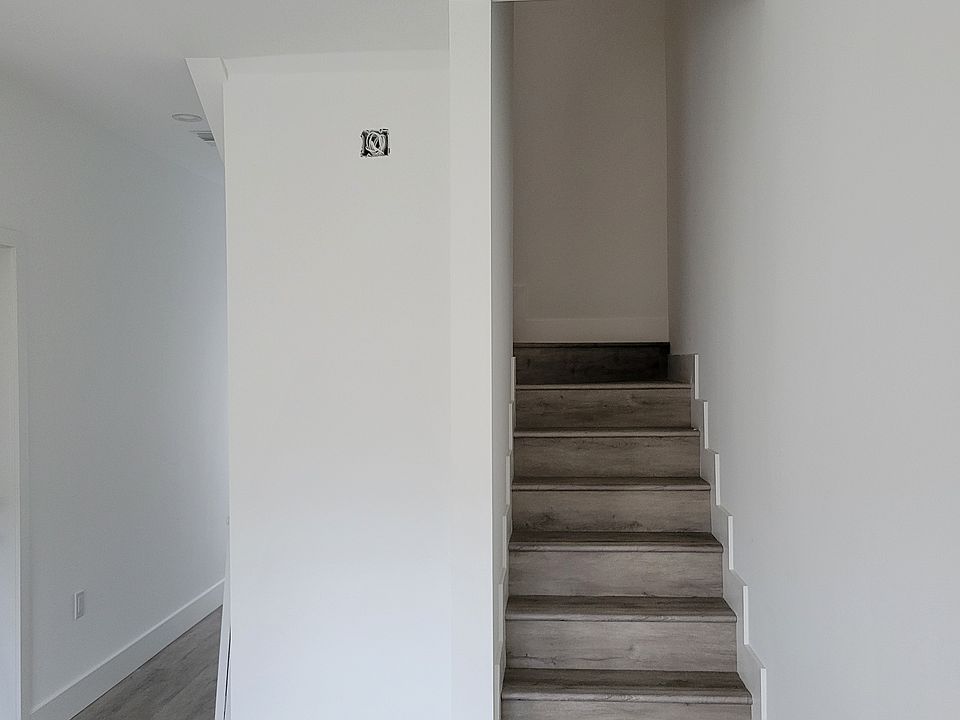 Elegant staircase leading to the upper level bedrooms.