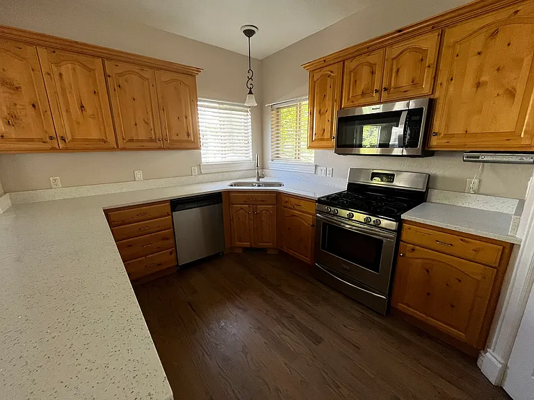 Brand new quartz countertops with new sink and faucet.