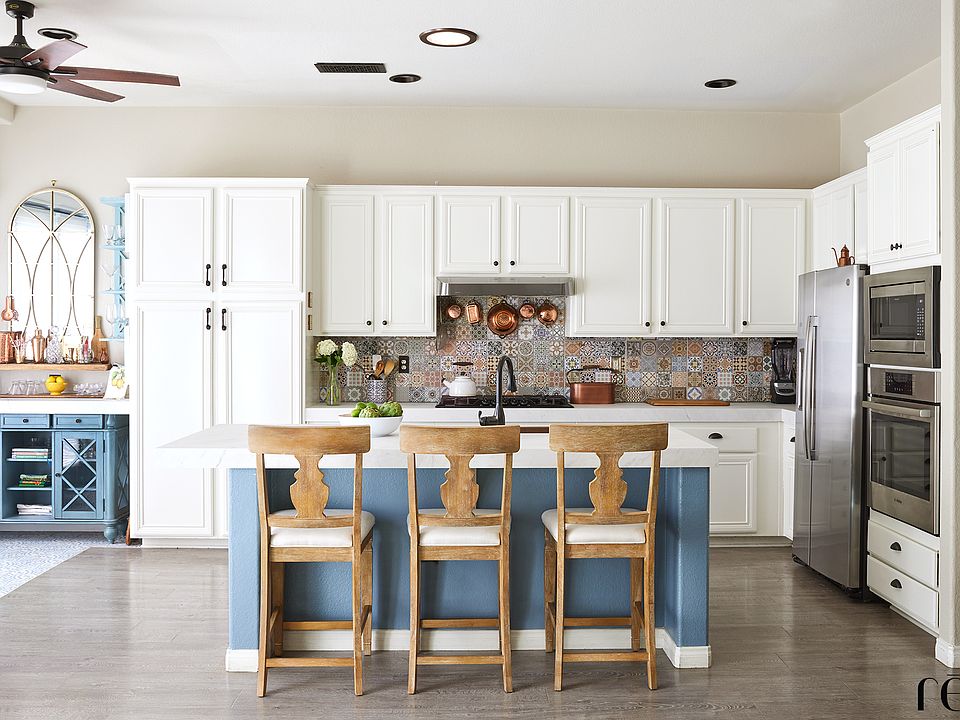 Kitchen and Island including charging outlets.