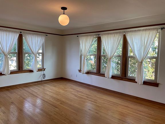 Living room, NE corner unit, light filled, fresh paint throughout unit