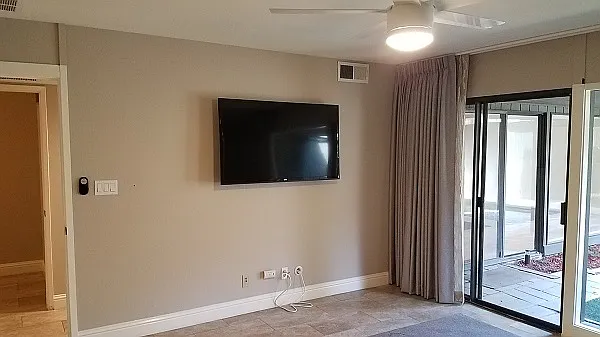 Master Bedroom door to courtyard, tv, ceiling fan.