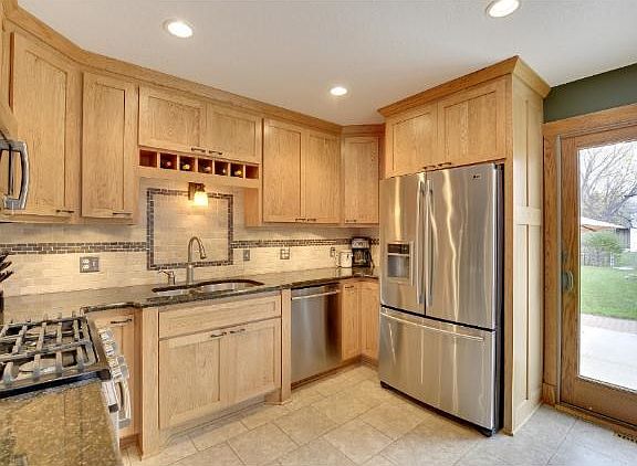 Gourmet style kitchen with custom shaker style cabinets, granite counter-tops, new stainless steel a