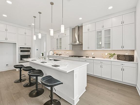 Well-equipped kitchen with white cabinets and ample countertop space