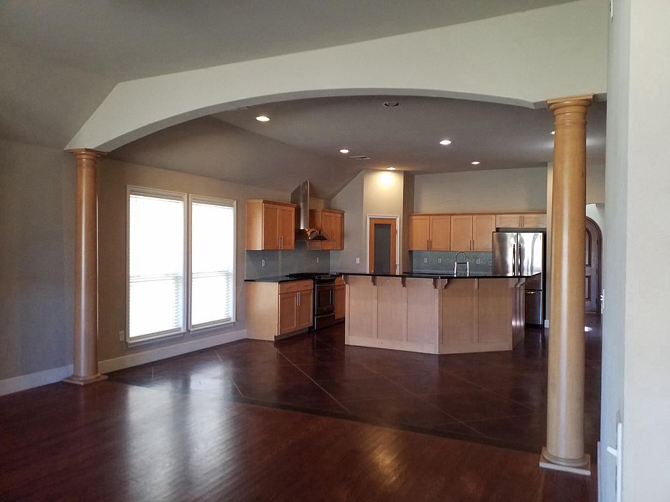 View of kitchen and dining area from living room