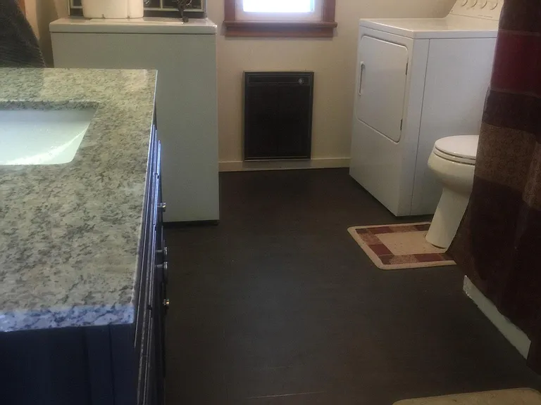 First floor bathroom and laundry new granite vanity new toilet in both baths and new flooring