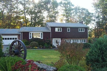 Open tri level home on lovely landscaped lot