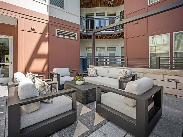 Unwind poolside on our cozy lounge seating, perfect for coffee, conversation, and sunshine.