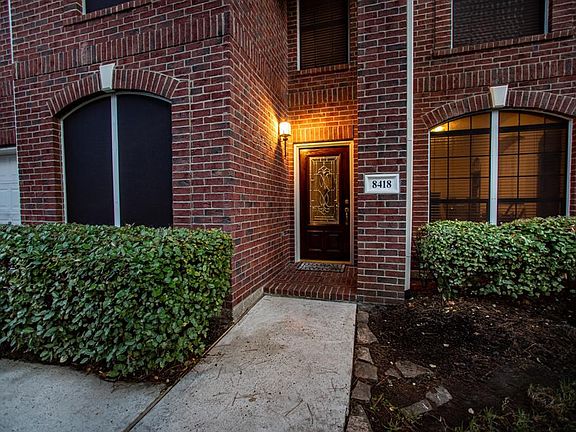 Beautiful brick homes features solar screens