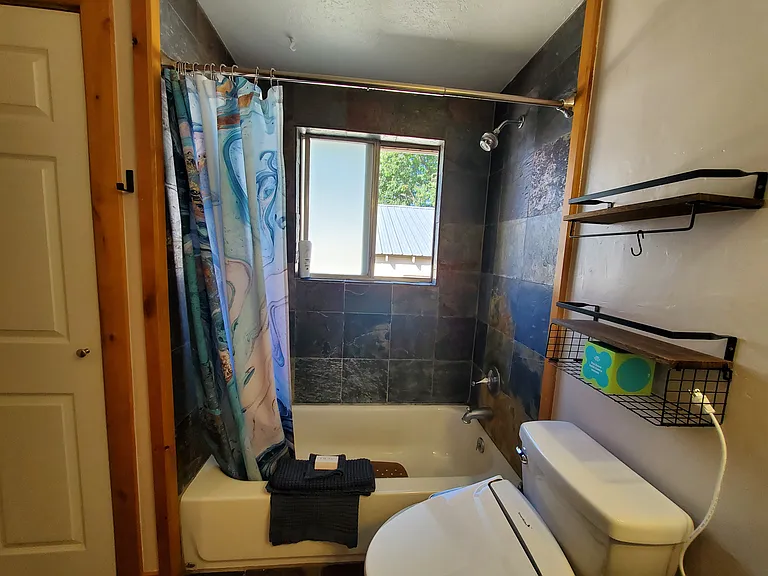 Feels almost like an outdoor shower with the tile and window.