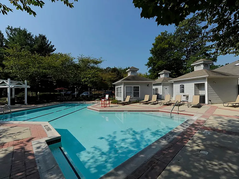 Swimming pool and sundeck with lounge seating