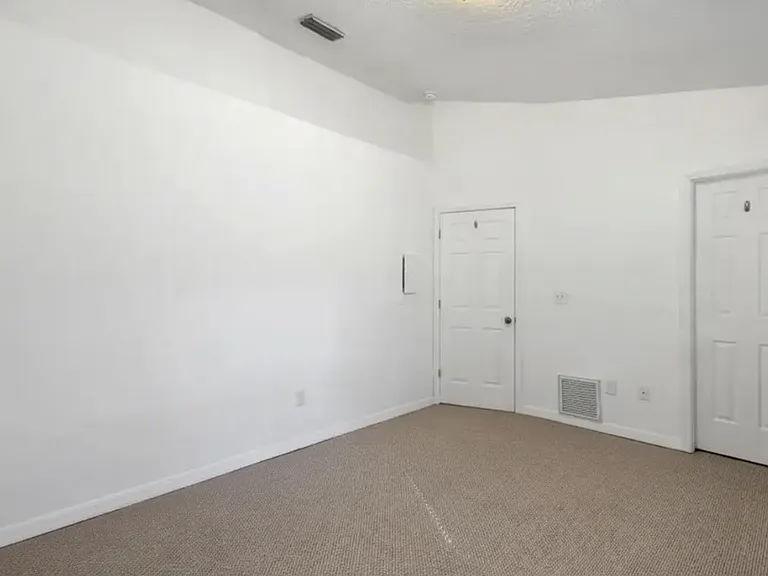 Second bedroom (door on right is walk-in closet)