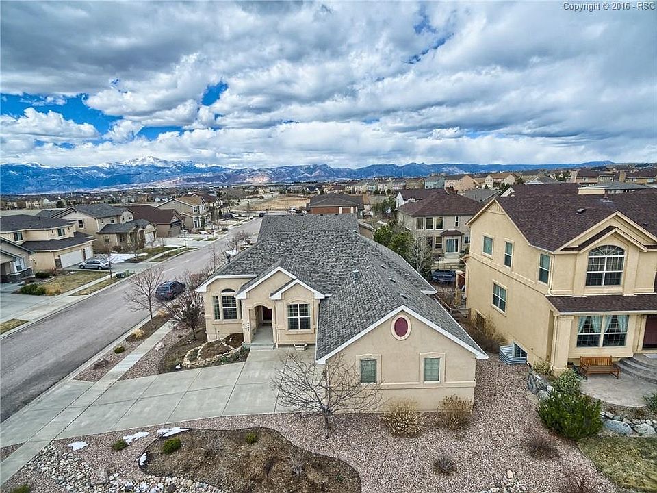 Wonderful one owner rancher in desirable Wolf Ranch with spectacular front range