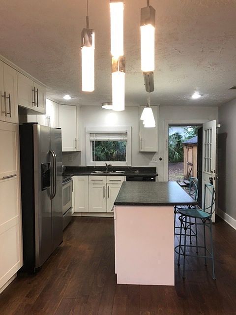 Kitchen looks into yard