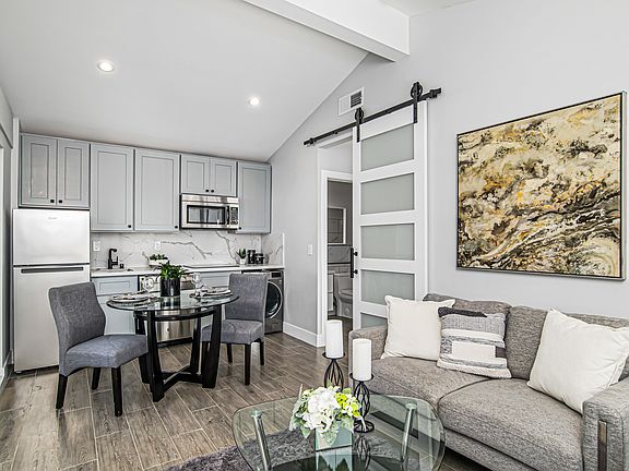 open floor living area with vaulted ceiling