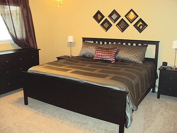 Master suite is spacious w/ recent carpeting, designer paint and a large walk in closet.