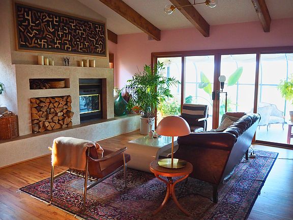 Living Room w/ Fireplace and attached Solarium